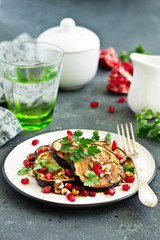 Fried eggplants with pomegranate sauce and nuts.