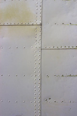 gray metal wall texture with seams and rivets