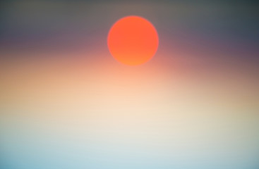 Abstract blurred view of sky and sunset sun. Can be used as nature background