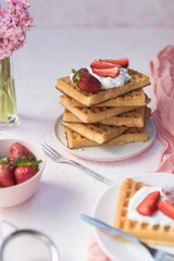 Fluffy Waffle with strawberries. Homemade belgian waffle.