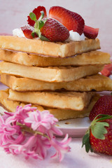 Waffles with strawberries and whipped cream