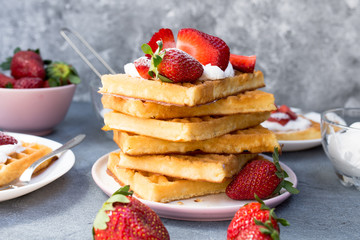 Homemade belgian Waffle. Strawberies and whiped cream.