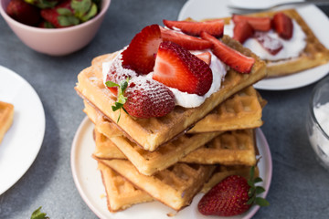 Homemade belgian Waffle. Strawberies and whiped cream.