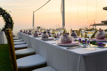 Table setting at a luxury wedding and Beautiful flowers on the table.
