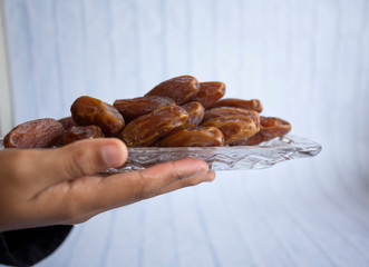 Ifthar Food evening meal for Ramadan kareem,Concept: Date of Islamic fasting,fruit date placed on a white background rosary