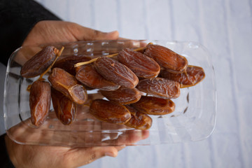 Ifthar Food evening meal for Ramadan kareem,Concept: Date of Islamic fasting,fruit date placed on a white background rosary