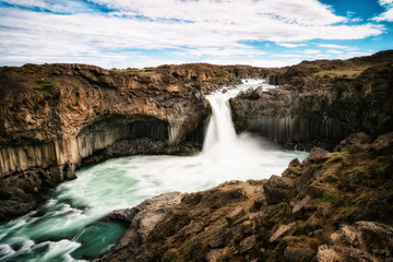 Icelandic summer landscape of the Aldeyjarfoss waterfall in north Iceland. The waterfall is...