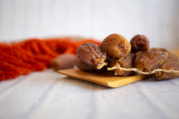 Ifthar Food evening meal for Ramadan kareem,Concept: Date of Islamic fasting,fruit date placed on a white background rosary