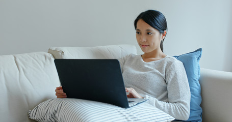 Woman work on laptop computer at home