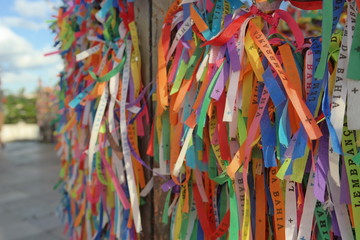Fototapeta premium Igreja de Nosso Senhor do Bonfim, a catholic church located in Salvador, Bahia in Brazil. Famous touristic place where people make wishes while tie the ribbons in front of the church. Carnival land.