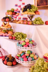 Delicious colored macaroons on candybar