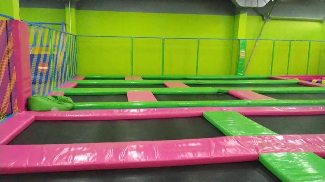jumping on a trapoline in the childrens amusement center POV view