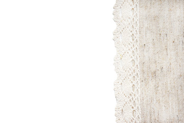 Beige linen canvas with lace edge isolated on white background. Texture of natural linen fabric with copy space for text. Top view.