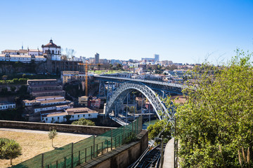 Porto city panorama with Douro River and bridge on a sunny day
