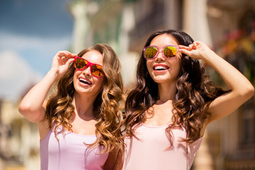 Unforgettable moments. Nice attractive elegant classy ladies best students travel trip feel hairstyle glad satisfied wear long hair colorful specs modern pink pastel clothes look center outside