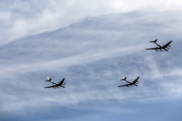 Fototapeta na wymiar Group of airplanes in the sky. Air display.