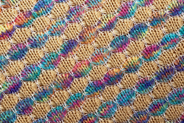 Fototapeta na wymiar Abstract background. Colored knitted fabric texture, diagonal lines, flat lay