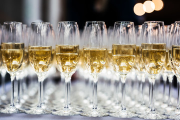 Row of full champagne glasses