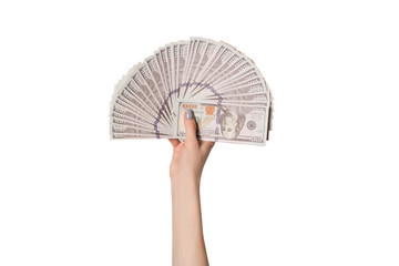 Female hand with a fan of 100 dollar American banknotes isolate on a white background