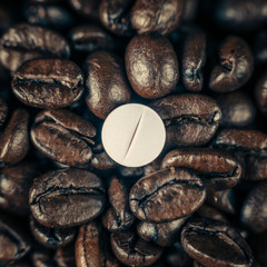 Caffeine Supplement Pill and Coffee Beans