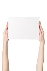 White rectangular box in female hands. Top view. Isolate
