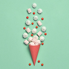 Marshmallow, meringue background. Ice Cream cone with Candy Sweets desert. Fashion Flat lay. Party, birthday firework. Pastel vanilla Color. Trendy creative art Style. Minimal sweet concept