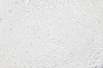 Water drops on glass, Rain droplets on glass background.