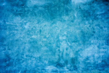 Grunge blue painted wall texture background.