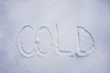 Cold word written in snow background