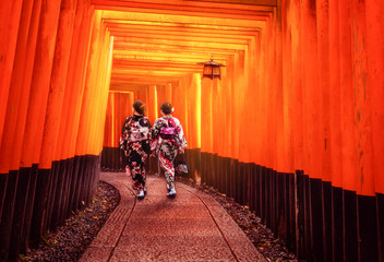 Kyoto, Japan Culture Travel - Asian traveler wearing traditional Japanese kimono walking in Fushimi...