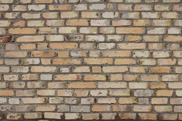 The brick texture, wall, with cracks and scratches can be used as a  background