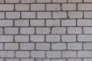 The brick texture, wall, with cracks and scratches can be used as a  background