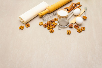 Raw ingredients for walnut pie. Baking concept cooking on stone background, copy space.