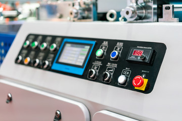 Close up emergency push button and display control panel of modern and high technology of automatic publication or printing machine
