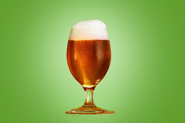Golden beer in glass with foam, alcohol beverage,  pub.