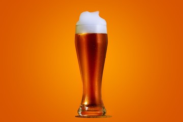 Golden beer in glass with foam, alcohol beverage,  copyspace.