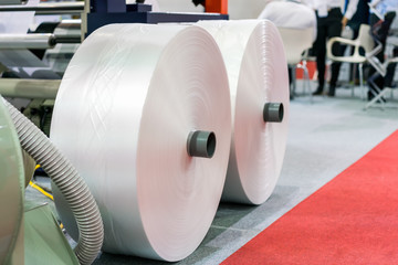 plastic sheet roll on ground is raw material for publication industrial high technology and modern automatic machine