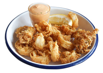 Isolated Fried squid rings breaded with lemon.