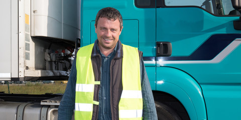 man driving lorry posing driver guy front of truck