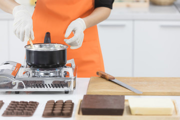 Woman making chocolate