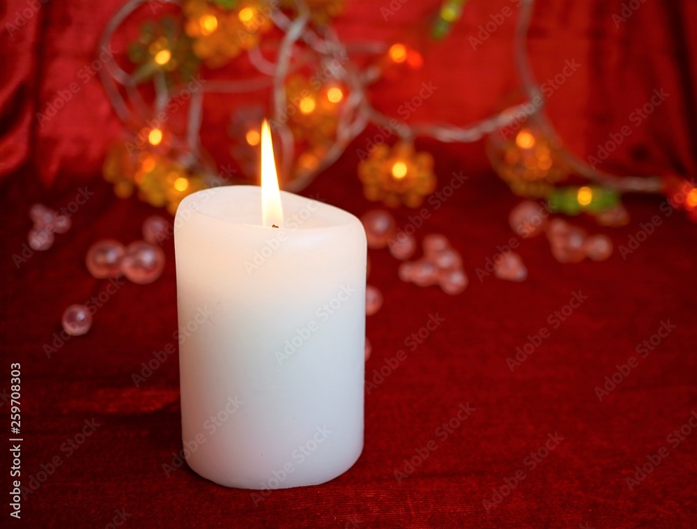 Wall mural candle on red background