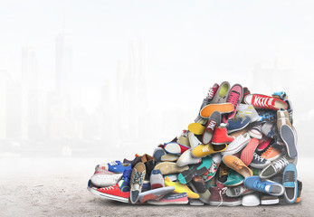Big sneaker made up of different sneakers - obrazy, fototapety, plakaty