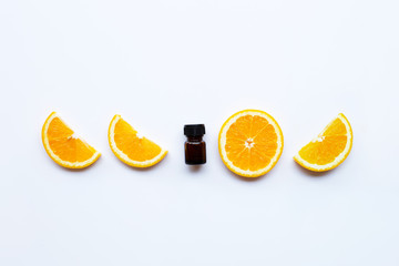 High vitamin C, Orange fruits with essential oil bottle on white