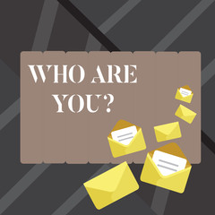 Text sign showing Who Are You question. Business photo showcasing asking about demonstrating identity or demonstratingal information Closed and Open Envelopes with Letter Tucked In on Top of Color