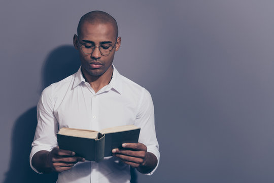 Close up photo amazing stunning dark skin he him his macho arms hands hold paper diary planner change sheets reader not smiling wondered shaved face wear specs white shirt isolated grey background