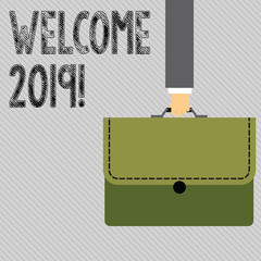 Text sign showing Welcome 2019. Business photo showcasing instance or analysisners of greeting someone like new year Businessman Hand Carrying Colorful Briefcase Portfolio with Stitch Applique