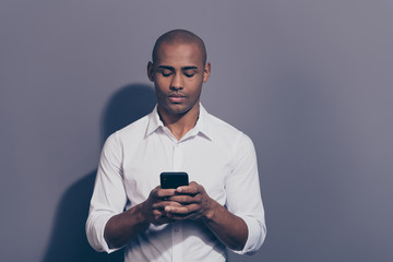 Close up photo amazing beautiful dark skin he him his macho perfect appearance telephone smart phone arms attentively reader writing letter corporate currency wear white shirt isolated grey background