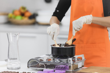 Woman making chocolate