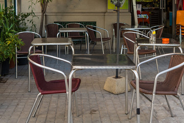 Summer street cafe with tables in the open. Cafe on the pedestrian street.