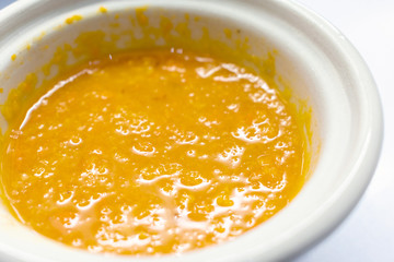 Asian Spicy Dipping Sauce in a White Sauce Dish.